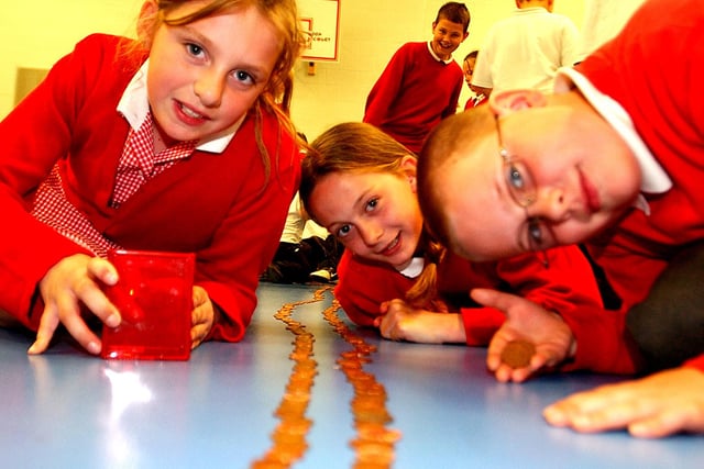 Another scene from 14 years ago. It shows pupils with a line of collected pennies but who can tell us more about the event?