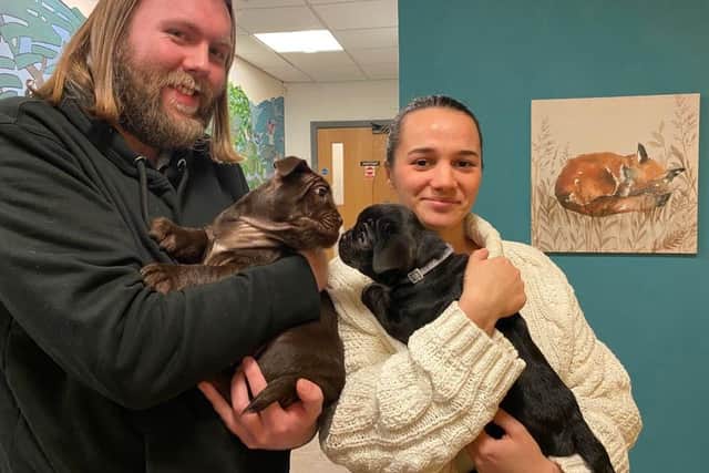 Tom Buckley with Otter and Ella Wright with Lenni, two of the newborn pups found dumped in Beeley Woods, near Middlewood, Sheffield. Tom and Ella have taken in Otter and Lenni after the abandoned pups were hand-reared by RSPCA staff and volunteers. Photo: RSPCA