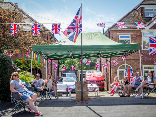 Neighbours celebrating with social distancing in Woodfield Avenue, Farlington