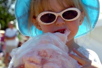 Young girl enjoys cotton candy in Westfield Park in 2006.