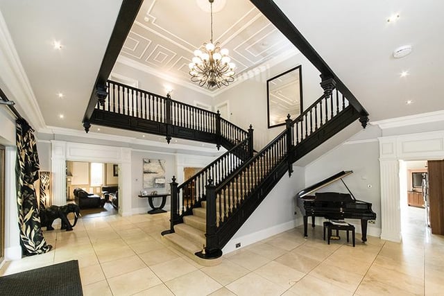 The front door opens to a fabulous reception hall which has travertine flooring and continues into the kitchen/breakfast room and utility areas. An impressive, feature staircase leads from the hall up to the first floor dividing and forming a gallery at the first floor landing.