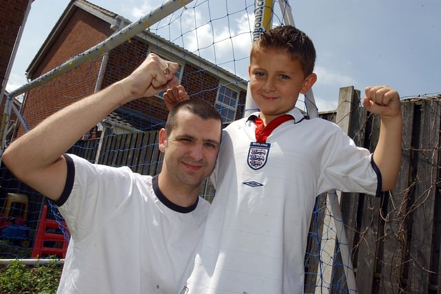 Sheffield Wednesday supporter Steve White and his son Ross celebrate in June 2003 after winning two seats for an entire year at the new Wembley Stadium when it opens.