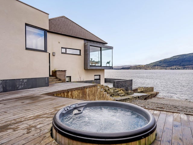 Guests can enjoy a soak in the cedar hot tub.