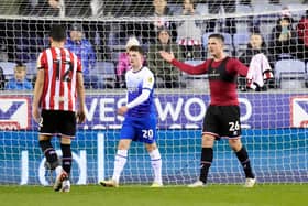 Ciaran Clark of Sheffield United protests at Wigan Athletic: Andrew Yates / Sportimage