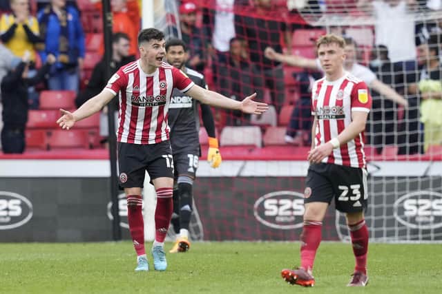 Sheffield United defender John Egan (left) has been hailed by researchers at the CIES: Andrew Yates / Sportimage