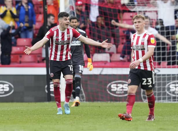 Sheffield United defender John Egan (left) has been hailed by researchers at the CIES: Andrew Yates / Sportimage
