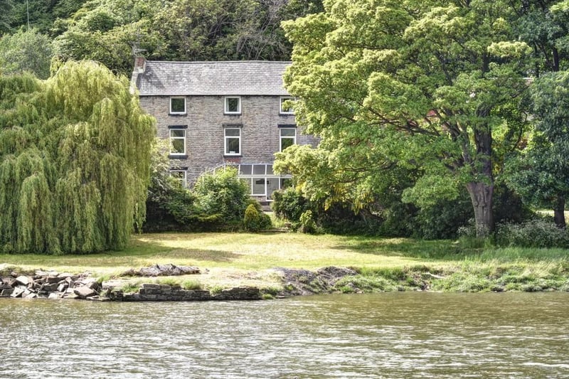 This stunning eight bed house in located on the riverside.