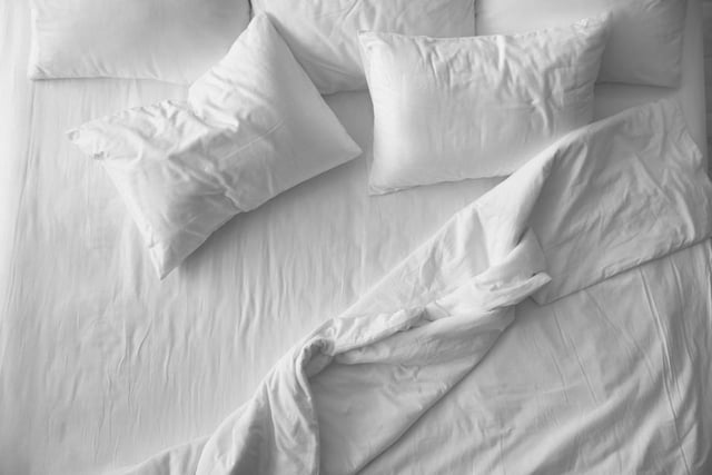 Pillows should be replaced as often as every six to 12 months if they are filled with synthetic material, and every two to three years for down pillows, as they start to attract dust mites and lose their shape over time, which can lead to neck pain.