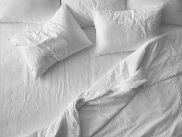 Pillows should be replaced as often as every six to 12 months if they are filled with synthetic material, and every two to three years for down pillows, as they start to attract dust mites and lose their shape over time, which can lead to neck pain.
