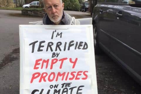 Dr Bing Jones with his sign that he used in his protest