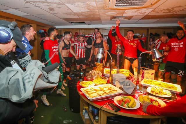 Sheffield United's dressing room celebrations after promotion was secured: Simon Bellis / Sportimage