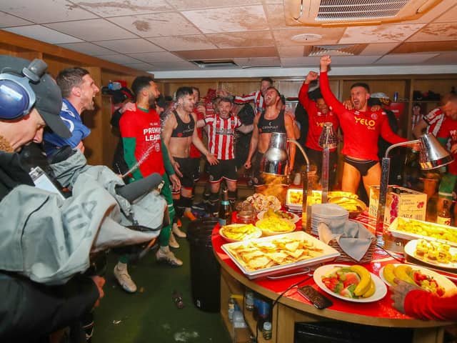 Sheffield United's dressing room celebrations after promotion was secured: Simon Bellis / Sportimage