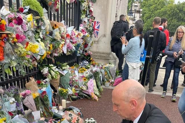 John Healey, Mp for Wentworth and Dearne laid flowers at the gates of Buckingham Palace this morning