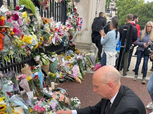 John Healey, Mp for Wentworth and Dearne laid flowers at the gates of Buckingham Palace this morning