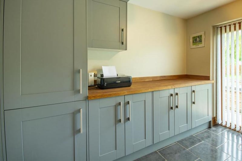 A bonus is this utility room, complete with units, cabinets, work surfaces and double doors leading outside. There is also a freezer, plus space and plumbing for a washing machine and tumble dryer.