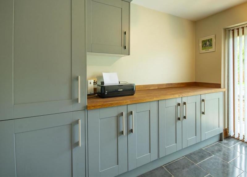A bonus is this utility room, complete with units, cabinets, work surfaces and double doors leading outside. There is also a freezer, plus space and plumbing for a washing machine and tumble dryer.