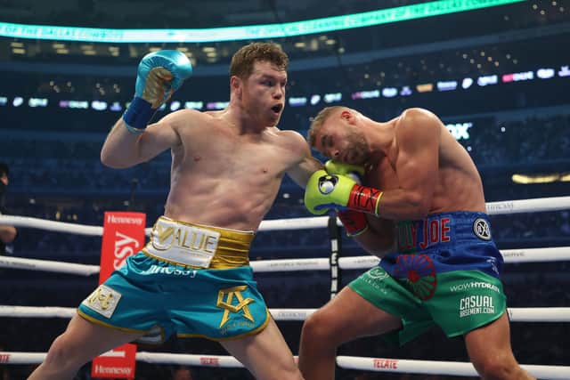 Canelo Alvarez punches Billy Joe Saunders during their fight for Alvarez's WBC and WBA super middleweight titles and Saunders' WBO super middleweight title at AT&T Stadium on May 08, 2021 in Arlington, Texas. (Photo by Al Bello/Getty Images)