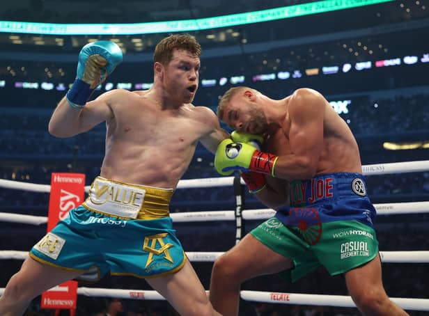 Canelo Alvarez punches Billy Joe Saunders during their fight for Alvarez's WBC and WBA super middleweight titles and Saunders' WBO super middleweight title at AT&T Stadium on May 08, 2021 in Arlington, Texas. (Photo by Al Bello/Getty Images)