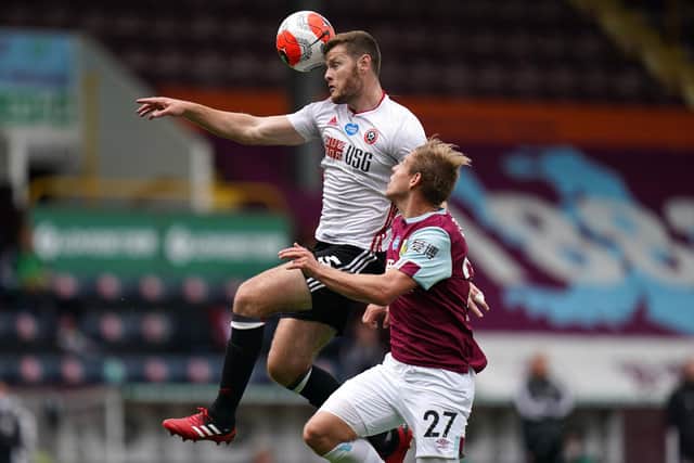 Burnley's Matej Vydra (bottom) and Sheffield United's Jack O'Connell battle for the ball during the Premier League match at Turf Moor, Burnley.  Jon Super/NMC Pool/PA Wire.