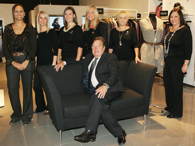 George Davis with some of the staff at his new G IV store in 2010