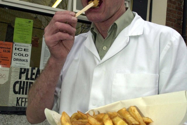 Bill Green outside the Harlequin Chip Shop on Howard Street to mark National Chip Week in February 2003