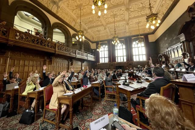 Councillors voting in Sheffield Town Hall council chamber.