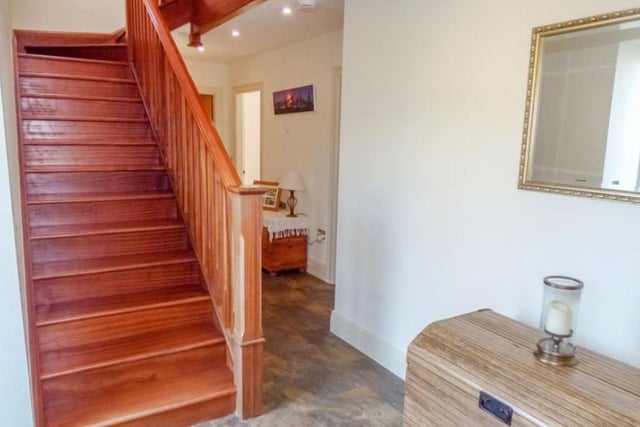 A welcoming entrance hallway with under floor heating, cloakroom cupboards and a cherry wood staircase. 

Picture: Right Move