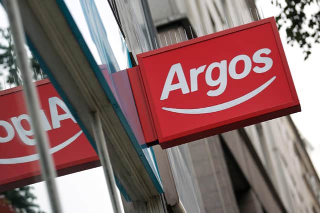 A picture shows the signage hanging outside an Argos home retail store   (Photo credit should read ANDREW COWIE/AFP via Getty Images)