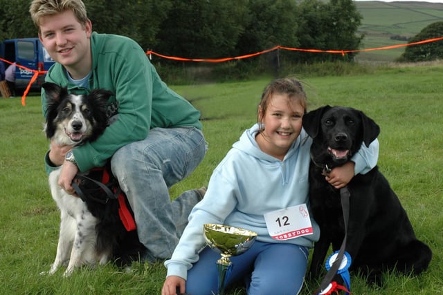 Pictured are Abbey Carter, right from Millers Dale with her dog Paddy, the winner of  6 rosettes from other classes and also Best in Show. Beside her is the reserve best in show Craig Bennett from Derby with Sprockett back in 2006