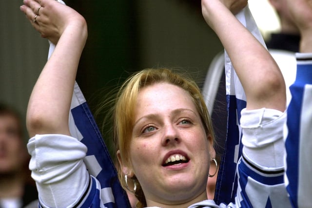 A Wednesday supporter gets behind her side at Burnley in April 2003.