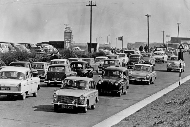 Traffic passes along the Coast Road at Marsden during the May Day heatwave in 1966.