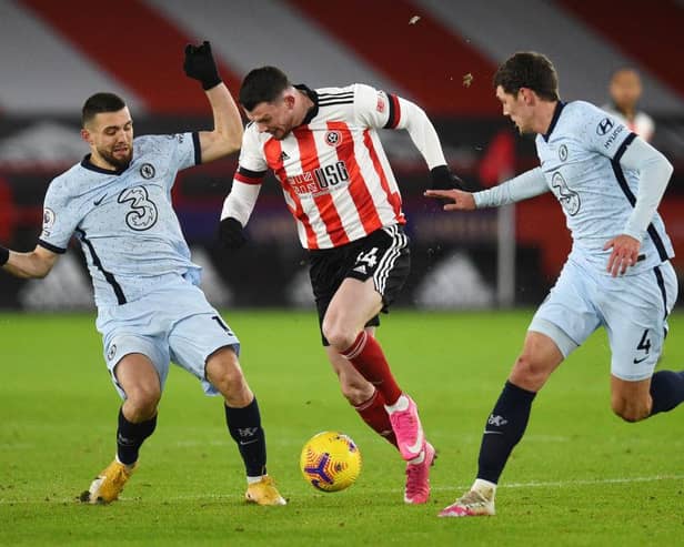 Oliver Burke of Sheffield United is challenged by (L - R) Mateo Kovacic and Andreas Christensen of Chelsea during the Premier League match between Sheffield United and Chelsea at Bramall Lane (Photo by Oli Scarff - Pool/Getty Images)
