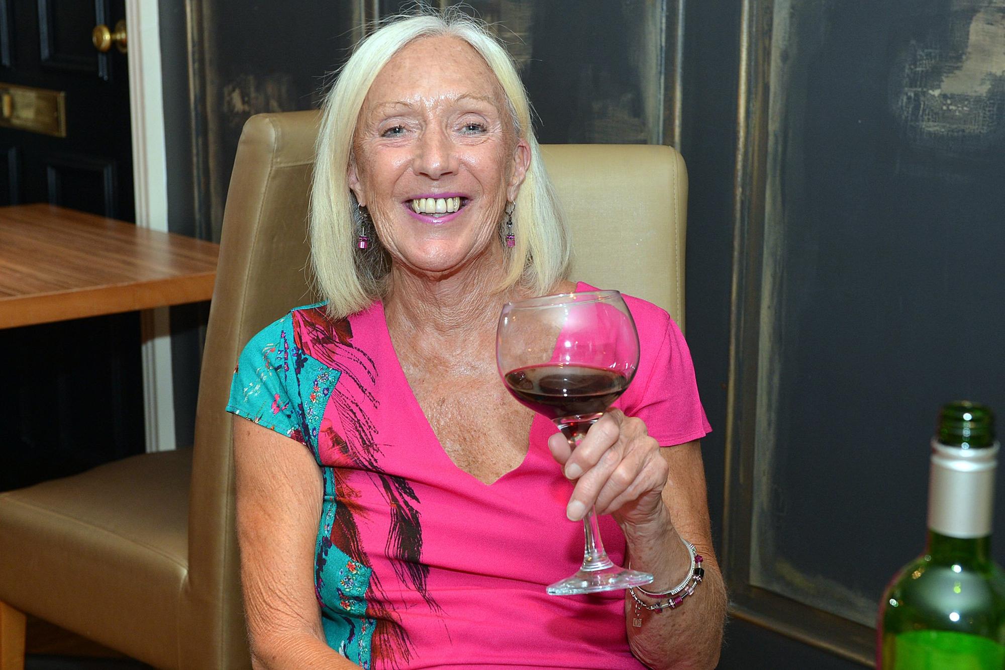 Sandy Lake enjoying a glass of wine.