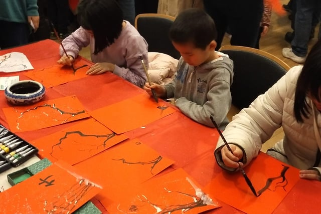 Families got to try their hand at Chinese calligraphy at craft tables.