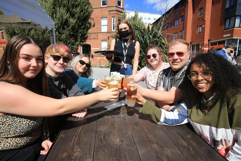 Friends celebrating the reopening of outdoor bar areas at The Forum, Sheffield