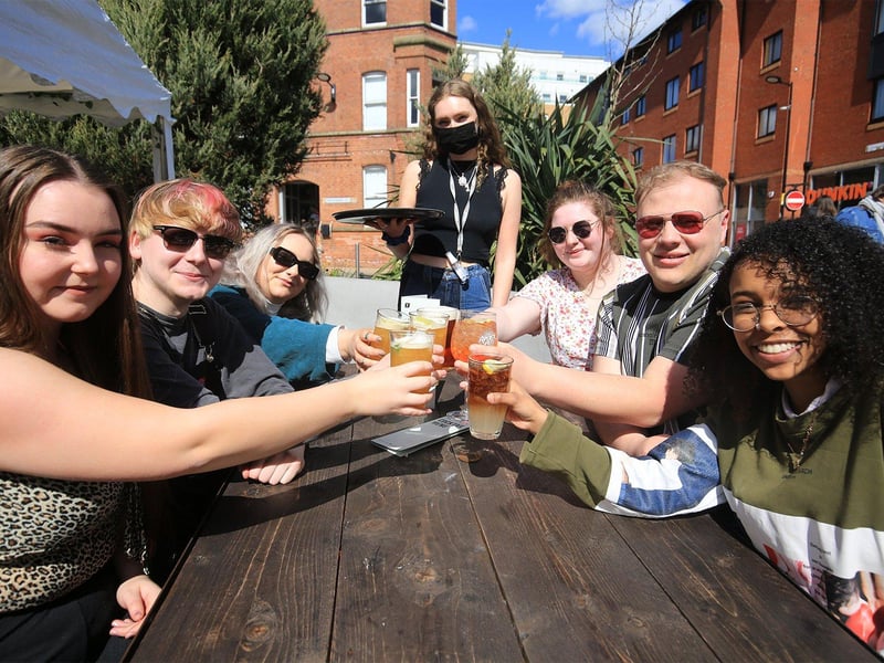 Friends celebrating the reopening of outdoor bar areas at The Forum, Sheffield