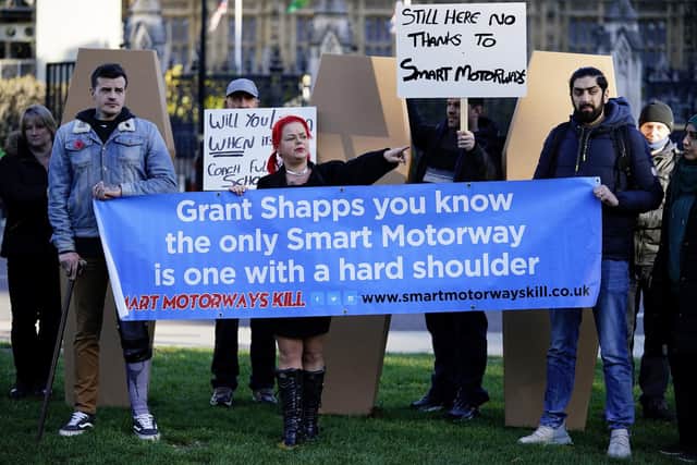 Demonstrators protesting against smart motorways march with coffins across Westminster Bridge to Parliament Square in London. Picture date: Monday November 1, 2021. PA Photo. See PA story TRANSPORT Smart. Photo credit should read: Aaron Chown/PA Wire