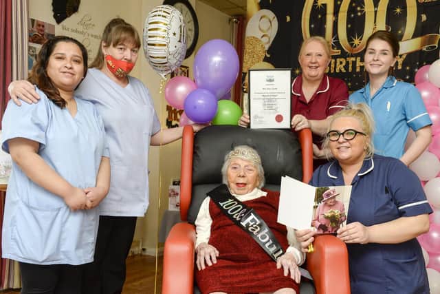 Alice Smith, better known as 'Queenie' celebrates her 100th birthday with staff at Darnall Grange Nursing home.