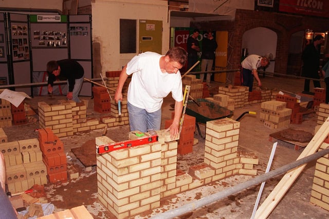 Pictured at the Construction Centre at Barnsley College, Old Mill Lane, Barnsley, where the Guild of Bricklayers Yorkshire Region brickwork competition took place seen centre is Dale Rhodes from Sheffield in action 1999