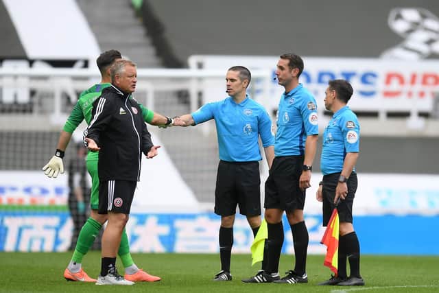 Sheffield United boss Chris Wilder talks to the match officials after his side's defeat to Newcastle United at St James' Park. /  (Photo by MICHAEL REGAN/POOL/AFP via Getty Images)