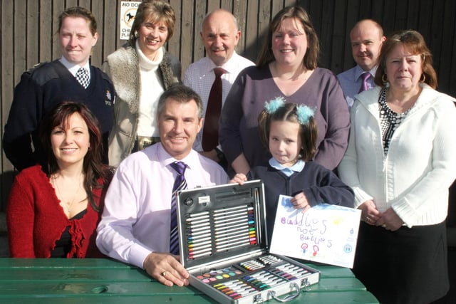 Bolsover infant and nursery school anti-bullying winner Ruby Redfern, congratulated by family, police,council and school staff.