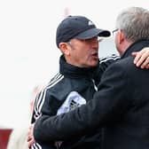 Manchester United Manager Sir Alex Ferguson embraces Stoke City Manager Tony Pulis (l) prior to the Barclays Premier League match between Stoke City and Manchester United at the Britannia Stadium on April 14, 2013 in Stoke on Trent, England.  (Photo by Julian Finney/Getty Images)