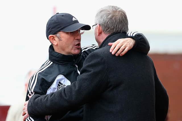 Manchester United Manager Sir Alex Ferguson embraces Stoke City Manager Tony Pulis (l) prior to the Barclays Premier League match between Stoke City and Manchester United at the Britannia Stadium on April 14, 2013 in Stoke on Trent, England.  (Photo by Julian Finney/Getty Images)