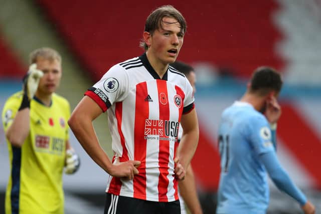 SHEFFIELD, ENGLAND - OCTOBER 31: A poppy is seen on the shirt of Sander Berge of Sheffield United during the Premier League match between Sheffield United and Manchester City at Bramall Lane on October 31, 2020 in Sheffield, England. Sporting stadiums around the UK remain under strict restrictions due to the Coronavirus Pandemic as Government social distancing laws prohibit fans inside venues resulting in games being played behind closed doors. (Photo by Catherine Ivill/Getty Images)