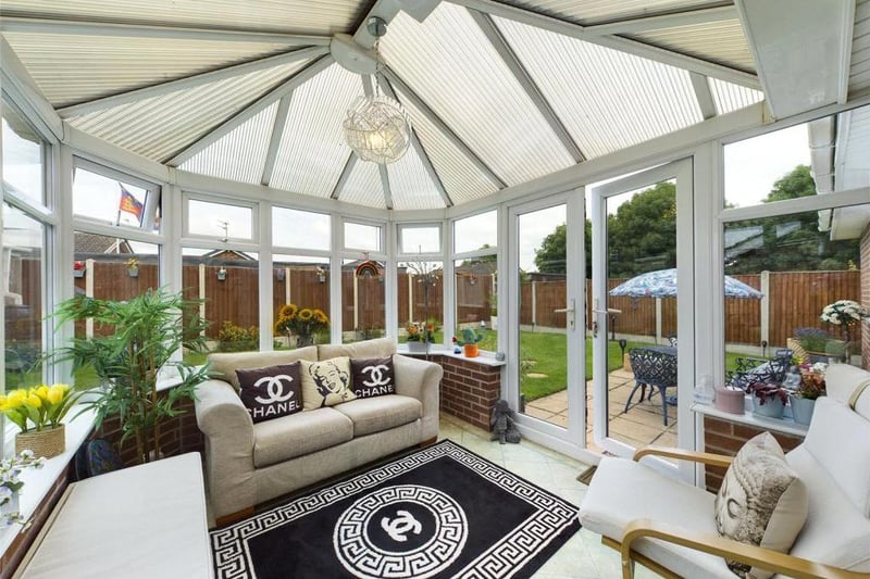 Conservatory - Comprising dwarf wall, double glazed panels and uPVC double glazed French style doors, attractive Karndean flooring, fitted air conditioning unit, power and lighting.