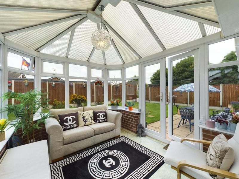Conservatory - Comprising dwarf wall, double glazed panels and uPVC double glazed French style doors, attractive Karndean flooring, fitted air conditioning unit, power and lighting.