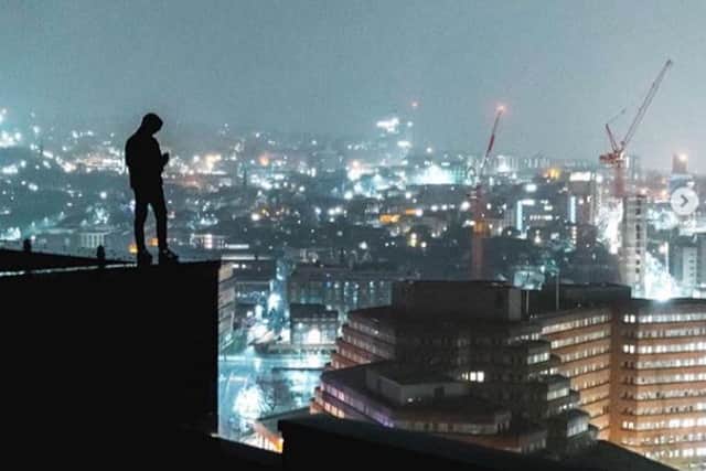 Ethan Raddon perched on the top of a tower overlooking the Moorfoot building in Sheffield city centre (pic: ethanraddon, via Instagram)