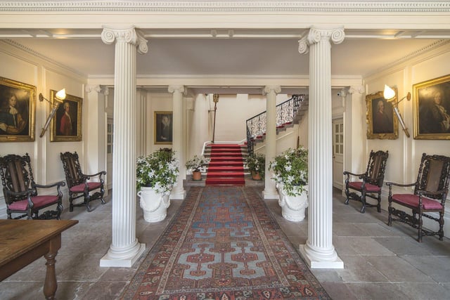 The welcoming hallway has Edward's original panelled walls and impressive columns that were added after the initial restoration.