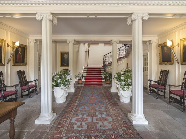 The welcoming hallway has Edward's original panelled walls and impressive columns that were added after the initial restoration.