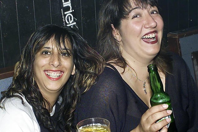 Having a drink between headbanging sessions were rock chicks Zarah and Sandra.